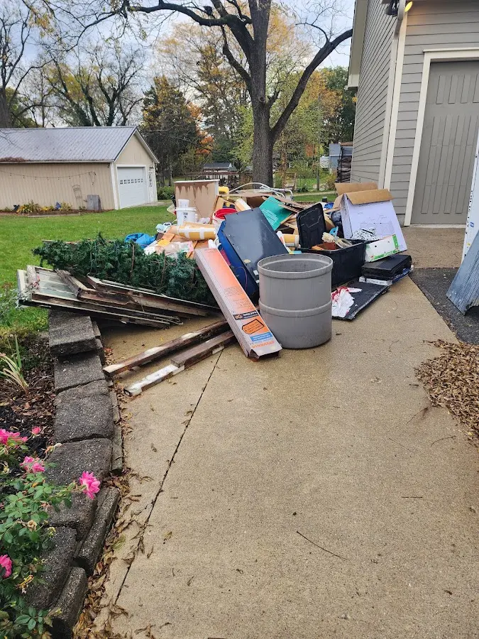 Dumpster being loaded with debris for 30 Yard Dumpster Rental in Bridgeport
